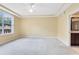 Bright main bedroom with carpet, large window and en-suite bathroom at 918 Lotus Vista Dr # 102, Altamonte Springs, FL 32714