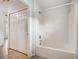 Bright bathroom with a shower-tub, closet and tile floors for low maintenance at 927 Cambridge Ct, Kissimmee, FL 34758
