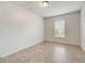 Neat bedroom with tile flooring provides a clean and minimalist aesthetic, complemented by natural light at 927 Cambridge Ct, Kissimmee, FL 34758
