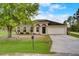 Charming single-story home with a well-manicured lawn and attached two-car garage at 927 Cambridge Ct, Kissimmee, FL 34758