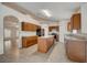 Open kitchen design with a center island, wooden cabinets, and stainless steel appliances at 927 Cambridge Ct, Kissimmee, FL 34758