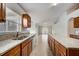 Well-lit kitchen featuring granite countertops, plenty of cabinet space, and stainless steel dishwasher at 927 Cambridge Ct, Kissimmee, FL 34758