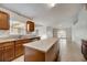 Bright, open kitchen with island, granite countertops, and ample cabinet space at 927 Cambridge Ct, Kissimmee, FL 34758