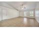 Bright living room with neutral walls, tiled flooring and an abundance of natural light at 927 Cambridge Ct, Kissimmee, FL 34758