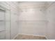 Walk-in closet with white wire shelving and tile floor at 927 Cambridge Ct, Kissimmee, FL 34758