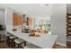 Bright kitchen with white quartz countertops, stylish cabinetry and stainless steel appliances at 9560 Archway Aly, Orlando, FL 32832