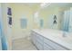 Bathroom features double sinks, large mirror, and shower with neutral tile at 9635 Fenrose Ter, Orlando, FL 32827