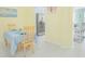 Dining area with tile floors, stainless steel appliances in the background at 9635 Fenrose Ter, Orlando, FL 32827