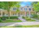 Charming townhome with a landscaped front yard and inviting porch at 9635 Fenrose Ter, Orlando, FL 32827