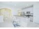 Open kitchen featuring stainless steel appliances, granite countertops, and breakfast bar seating at 9635 Fenrose Ter, Orlando, FL 32827