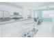 Modern open concept kitchen with stainless steel appliances and eat-in breakfast bar at 9635 Fenrose Ter, Orlando, FL 32827
