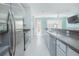 Bright kitchen features stainless appliances, granite countertops, and ample cabinet space at 9635 Fenrose Ter, Orlando, FL 32827