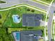 Aerial view of the house and surrounding landscaped yard, including a pool and outdoor living area at 9877 Laurel Berry Dr, Orlando, FL 32827