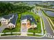 Gorgeous neighborhood aerial view showcasing the house and community, including green spaces and lakes at 9877 Laurel Berry Dr, Orlando, FL 32827