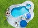 Aerial view of the backyard oasis featuring a pool, spa, fire pit, and lounge area at 9877 Laurel Berry Dr, Orlando, FL 32827