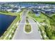 Community aerial view showcasing beautiful homes, lush landscaping, and serene lakes in an upscale neighborhood at 9877 Laurel Berry Dr, Orlando, FL 32827