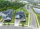 Aerial shot of the home, manicured lawn, pool, and surrounding neighborhood at 9877 Laurel Berry Dr, Orlando, FL 32827