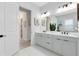 Bright bathroom with double sinks and contemporary fixtures at 9877 Laurel Berry Dr, Orlando, FL 32827