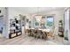 Dining room with chandelier and natural light and view to pool at 9877 Laurel Berry Dr, Orlando, FL 32827