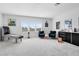 Spacious game room with fun activities, comfortable seating, and ample natural light at 9877 Laurel Berry Dr, Orlando, FL 32827