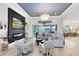 Bright living room with a modern fireplace, stylish decor, and access to the outdoor area, creating a seamless indoor-outdoor flow at 9877 Laurel Berry Dr, Orlando, FL 32827