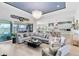 Open-concept living space featuring a modern kitchen, comfortable seating, and sliding glass doors leading to the outdoor area at 9877 Laurel Berry Dr, Orlando, FL 32827
