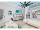 Spacious main bedroom with a blue ceiling, canopy bed, and a TV at 9877 Laurel Berry Dr, Orlando, FL 32827