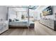 Open and airy main bedroom with a blue ceiling and canopy bed at 9877 Laurel Berry Dr, Orlando, FL 32827