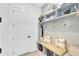 Charming mudroom with seating, storage, and stylish decor, creating an organized transition space at 9877 Laurel Berry Dr, Orlando, FL 32827
