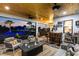 Entertainer's dream featuring an outdoor bar, comfortable seating, and views of the resort-style backyard at 9877 Laurel Berry Dr, Orlando, FL 32827