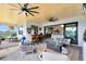 Well-appointed outdoor patio with bar, seating, and access to the interior living spaces at 9877 Laurel Berry Dr, Orlando, FL 32827