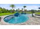 Sparkling blue pool with a dolphin water feature and well-manicured landscaping at 9877 Laurel Berry Dr, Orlando, FL 32827