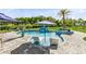 Gorgeous backyard pool with lounge chairs and umbrellas, perfect for enjoying sunny days in a private oasis at 9877 Laurel Berry Dr, Orlando, FL 32827