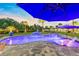 Relaxing backyard pool with comfortable seating, a spa, and an umbrella, creating a serene outdoor retreat at 9877 Laurel Berry Dr, Orlando, FL 32827