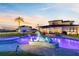 Expansive backyard with a custom pool, a relaxing spa, modern seating, and an oversized dog sculpture at 9877 Laurel Berry Dr, Orlando, FL 32827