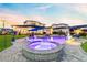 Stunning backyard pool and spa with a soothing ambiance, surrounded by well-maintained landscaping at 9877 Laurel Berry Dr, Orlando, FL 32827
