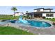 Stunning pool with a spa, a playful dolphin water feature, and ample patio space for entertaining at 9877 Laurel Berry Dr, Orlando, FL 32827