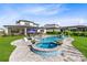 Inviting backyard pool and spa with beautiful landscaping, perfect for relaxation and entertaining at 9877 Laurel Berry Dr, Orlando, FL 32827
