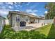 Lush backyard featuring a patio area, ideal for outdoor living and enjoying the natural surroundings at 9931 Cypress Knee Cir, Orlando, FL 32825