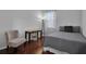 Cozy bedroom featuring a wooden desk and chair near a window with natural light at 9931 Cypress Knee Cir, Orlando, FL 32825