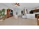 Spacious living room with tile floors, comfortable seating, and an open layout to the kitchen at 9931 Cypress Knee Cir, Orlando, FL 32825