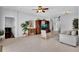 Spacious living room with tile floors, a large entertainment center, and neutral-toned furniture at 9931 Cypress Knee Cir, Orlando, FL 32825
