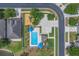 Aerial view features a pristine community pool, playground, and sport court nestled in a well-maintained neighborhood at 9931 Cypress Knee Cir, Orlando, FL 32825