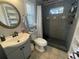 Modern bathroom featuring a walk-in shower, stylish mirror, and elegant fixtures at 1001 Arden St, Longwood, FL 32750