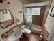 Cozy bathroom with tiled walls, a cactus shower curtain, and a classic pedestal sink at 1001 Arden St, Longwood, FL 32750