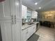 Spacious kitchen area highlighting cabinets, granite countertops, and stainless steel sink at 1001 Arden St, Longwood, FL 32750