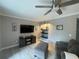 Comfortable living room featuring a large TV, stylish decor, and cozy seating with lots of natural light at 1001 Arden St, Longwood, FL 32750