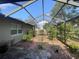 Screened patio with lush landscaping provides a serene outdoor living space at 1001 Arden St, Longwood, FL 32750