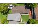 Aerial view of the home showcasing the roof and the well maintained lawn and landscaping at 101 E Lauren Ct, Fern Park, FL 32730
