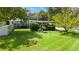 Spacious backyard featuring lush lawn, mature trees, and privacy fence at 101 E Lauren Ct, Fern Park, FL 32730
